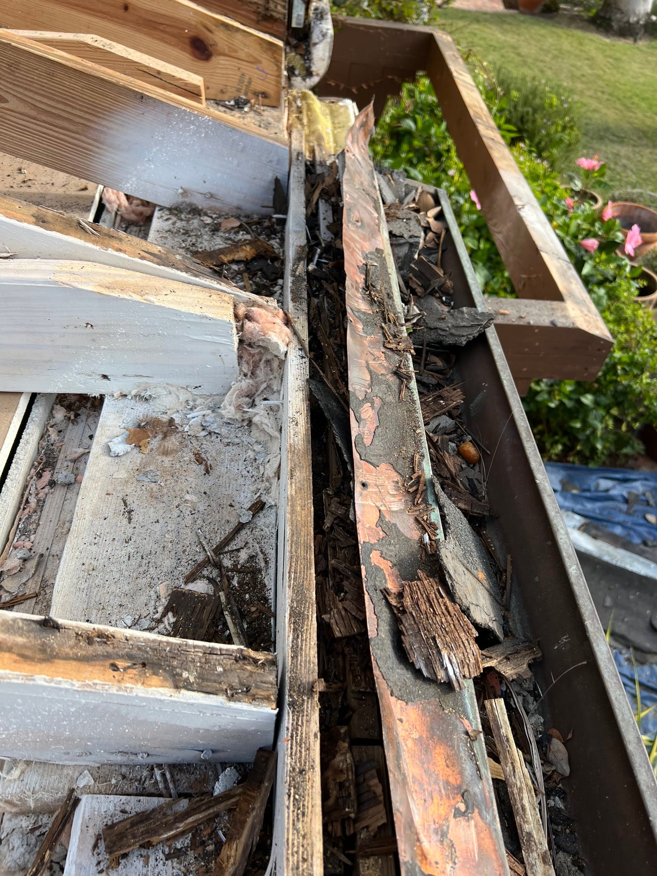During: failed wood and copper at the gutter — why the eave could not be painted and left