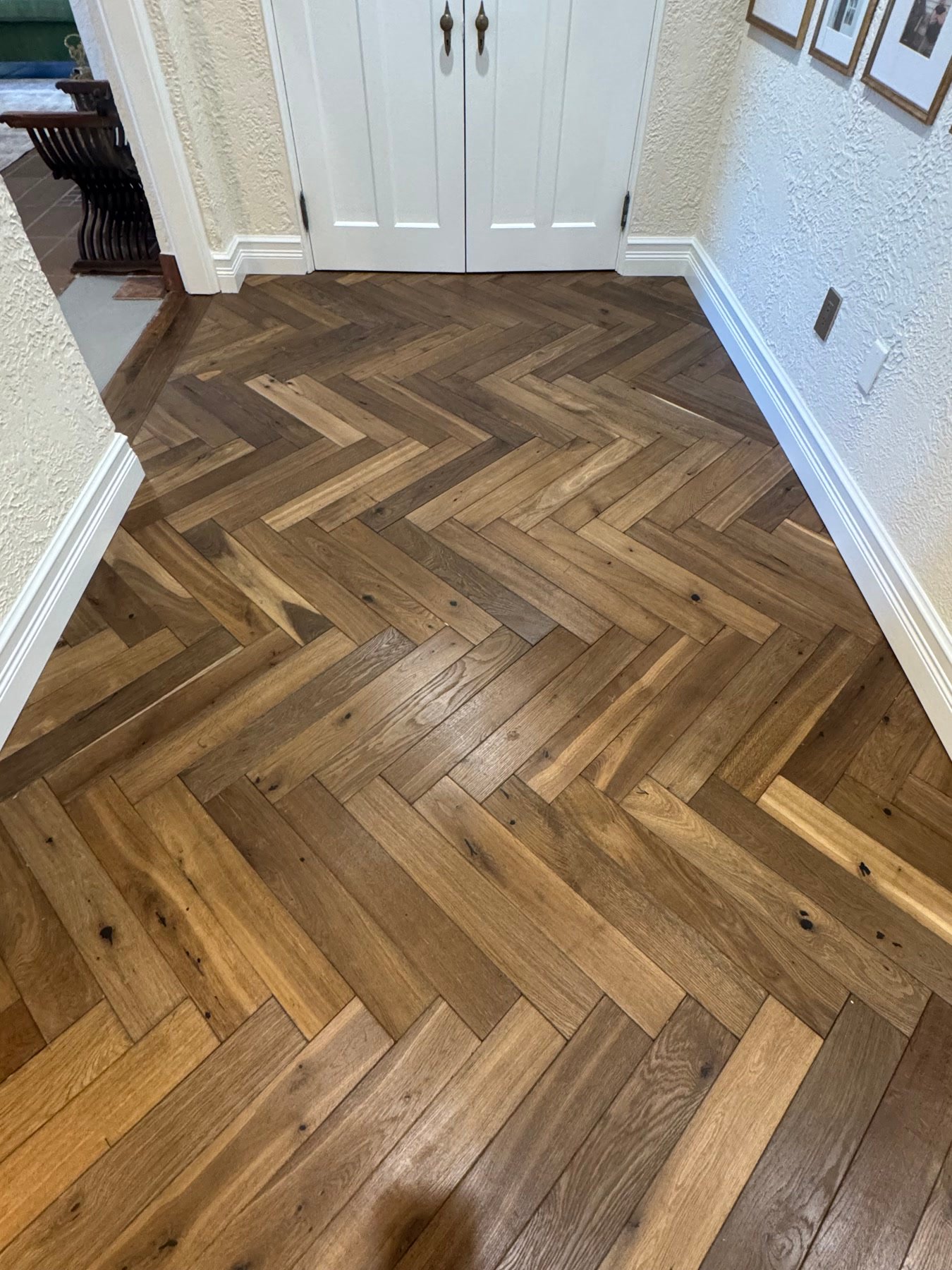 During: herringbone wood floors where the house wanted wood, not tile