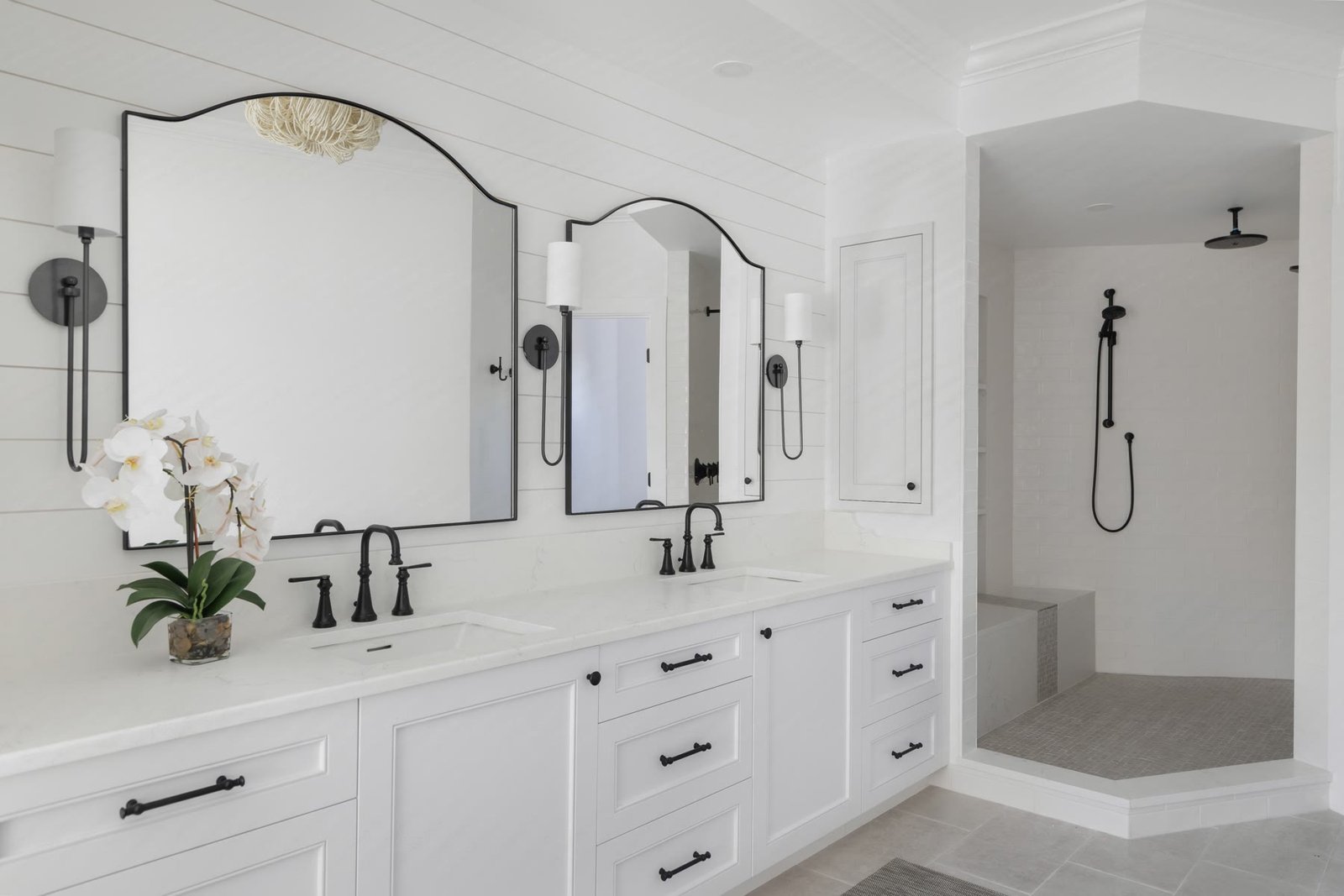 Primary bath after the suite was reconfigured — soaking tub and vanity wall as one room