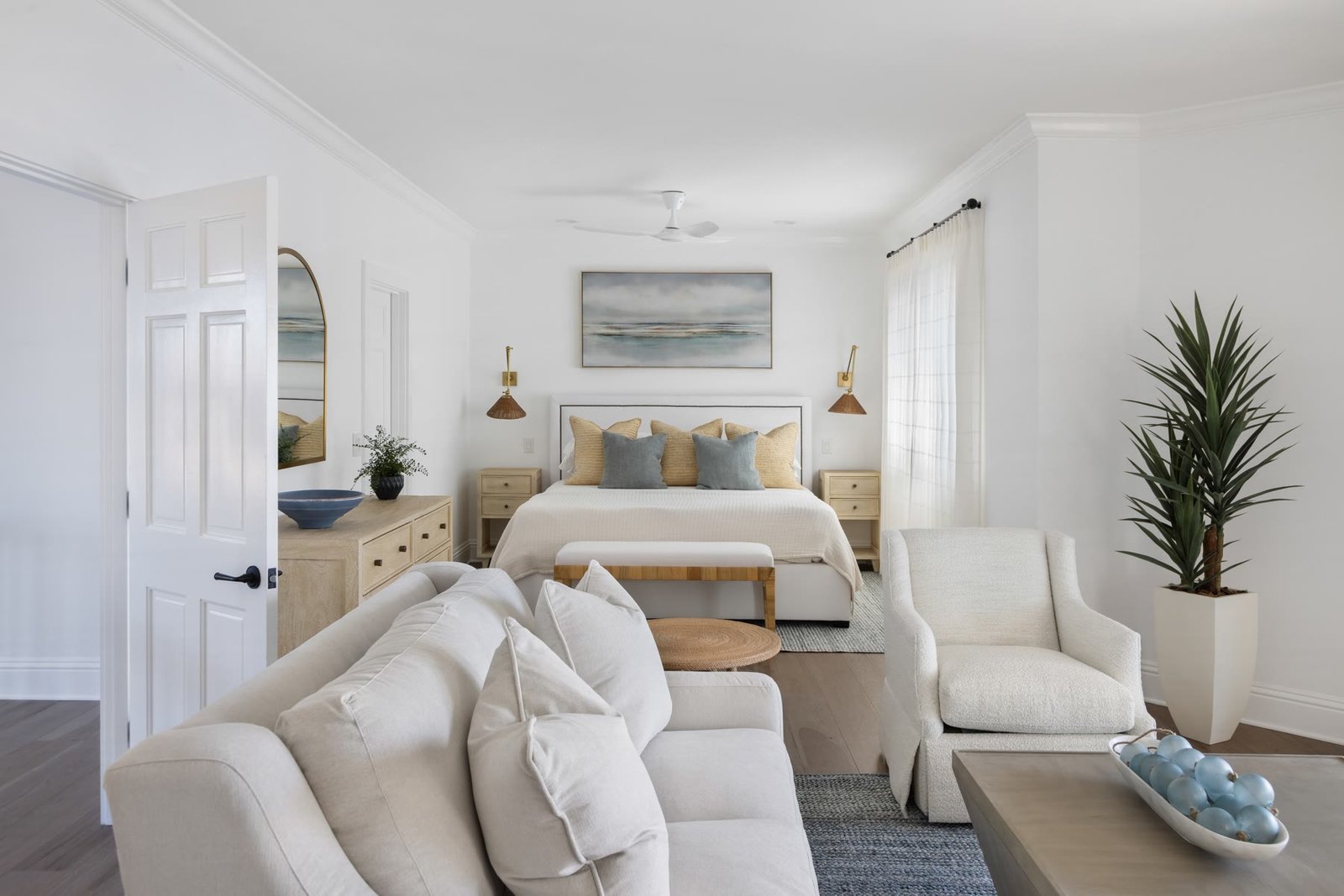 Primary bedroom with a sitting area after the suite was replanned