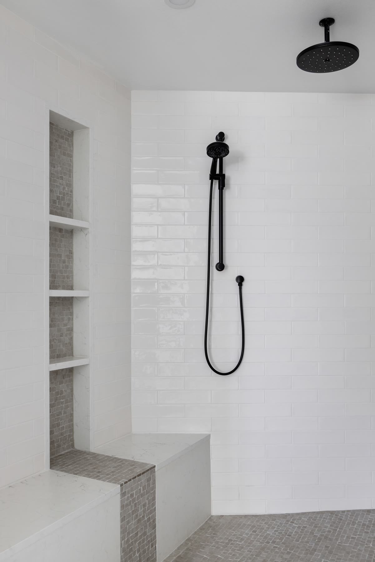 Shower bench and mosaic niche in the rebuilt primary bath