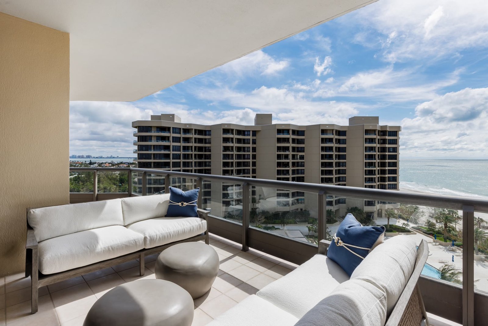 Furnished gulf-front balcony at Water Club, looking toward the beach and neighboring towers