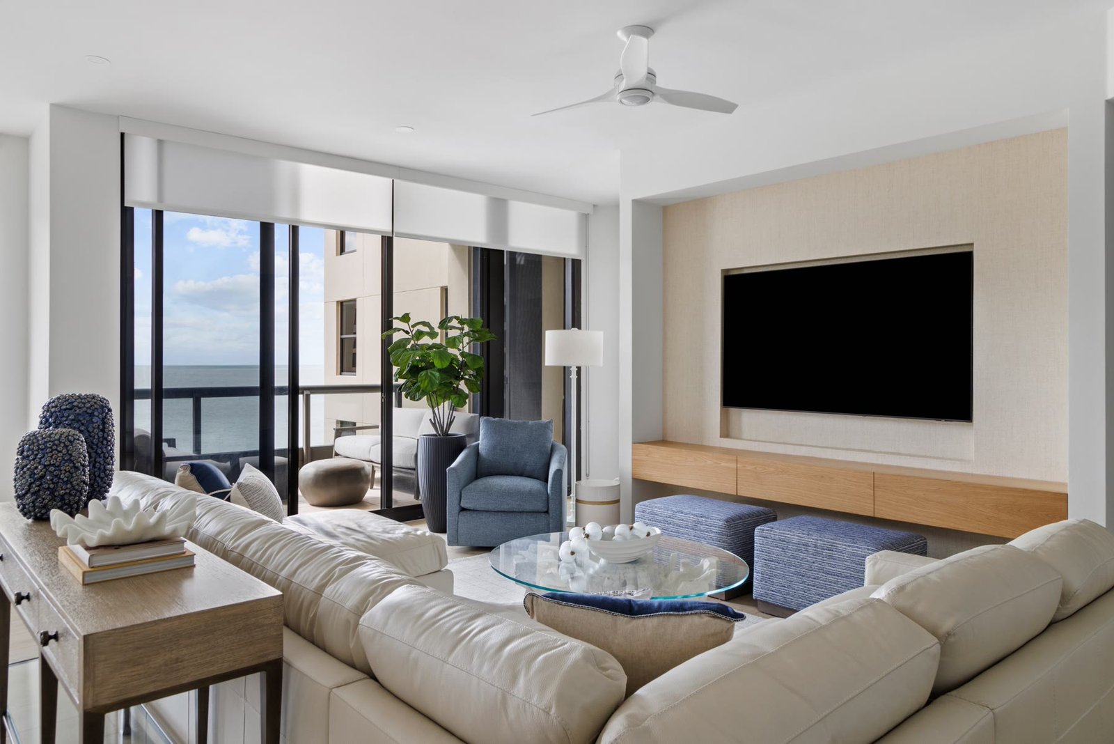 Living room looking through full-height sliders to the Gulf of Mexico