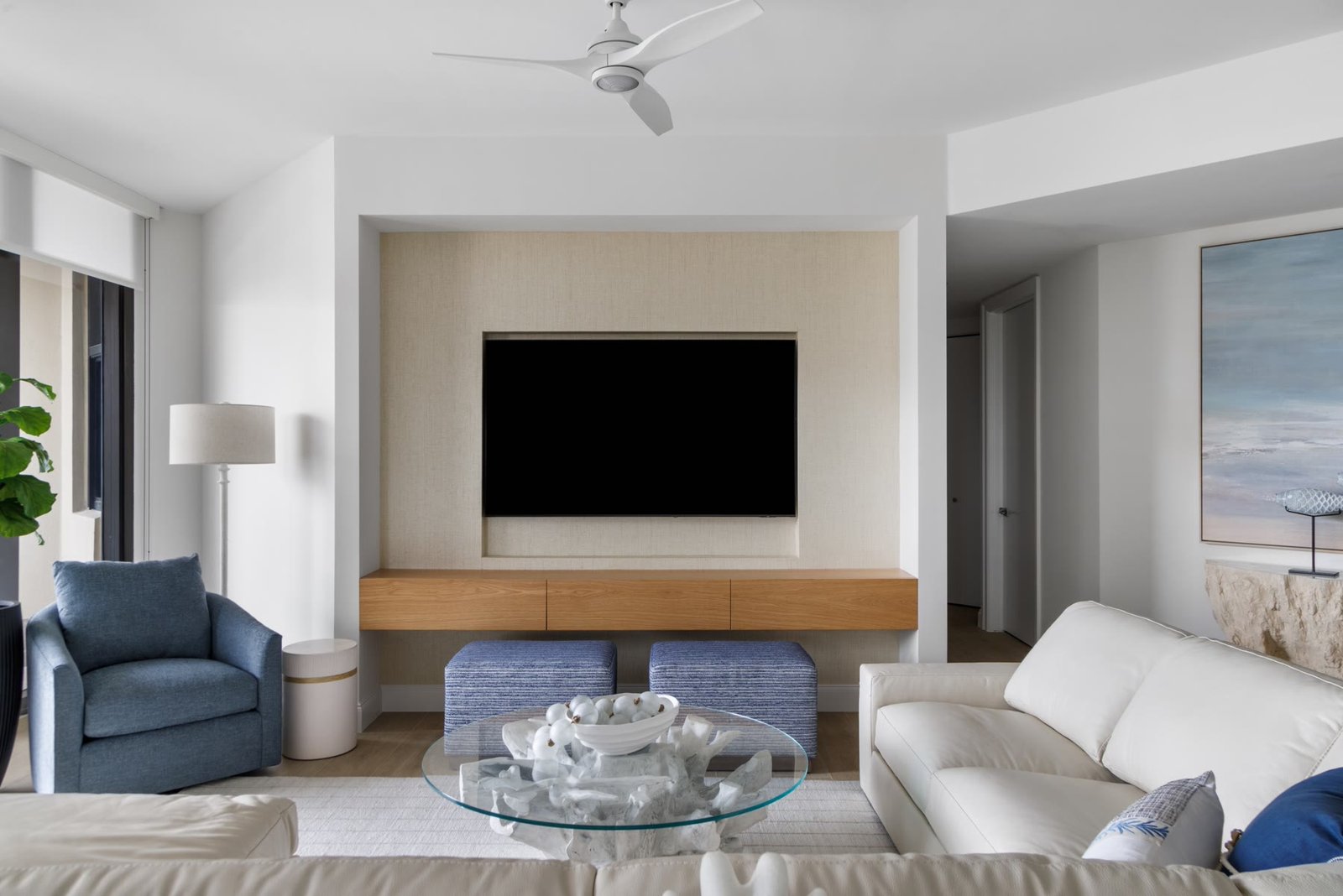 Replanned living room with a new interior overhang, recessed lighting, and a gulf-facing seating wall