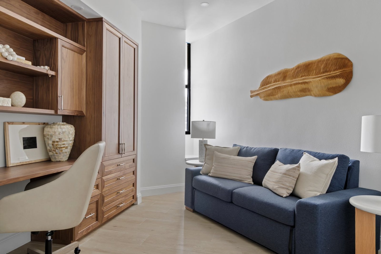 Guest suite / office with walnut millwork and a sitting sofa