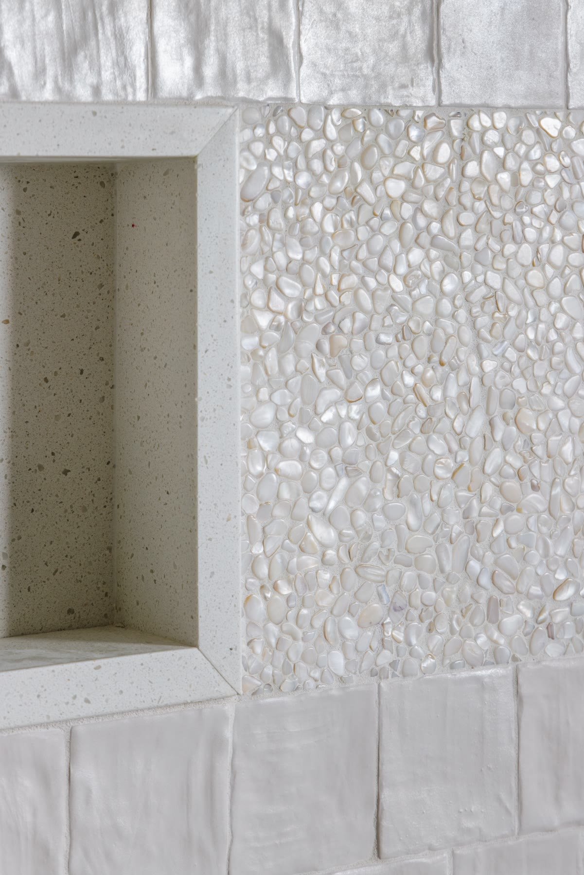 Mother-of-pearl mosaic and a built-in shower niche