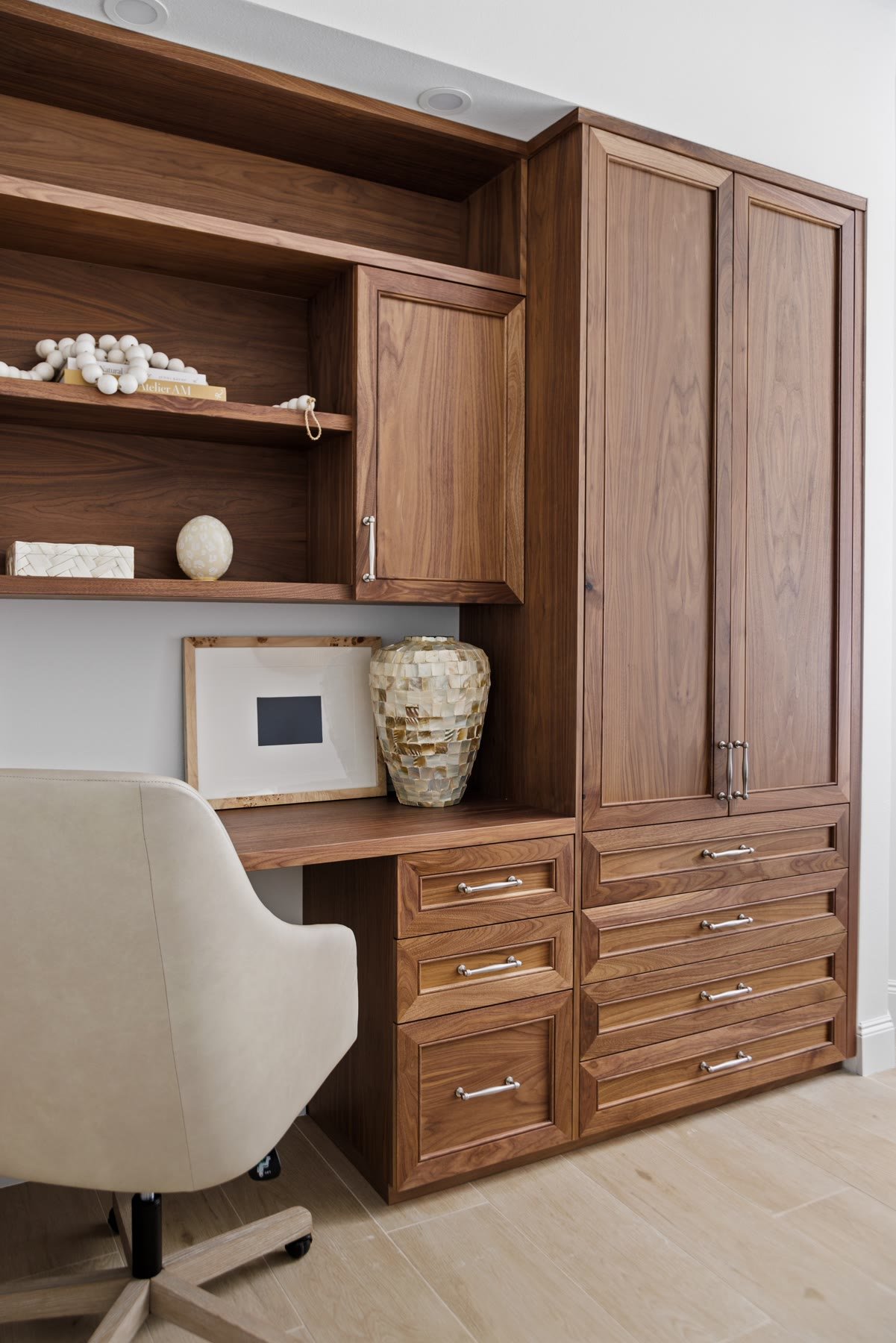 Guest suite office — walnut built-in desk and storage carved from leftover living space